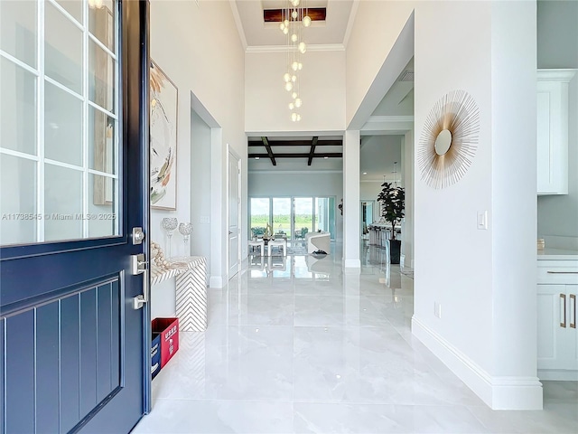 entrance foyer featuring ornamental molding