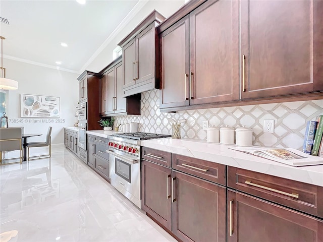 kitchen with pendant lighting, crown molding, appliances with stainless steel finishes, light stone counters, and decorative backsplash