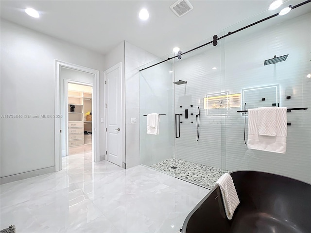 bathroom featuring a shower with shower door