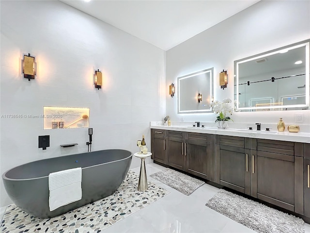 bathroom with vanity and a bathtub