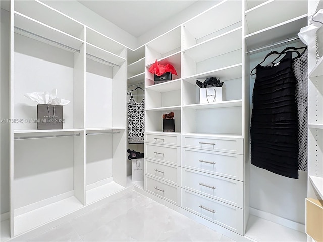 walk in closet featuring light tile patterned floors