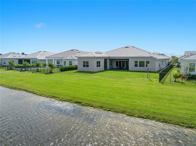 ranch-style home featuring a front lawn