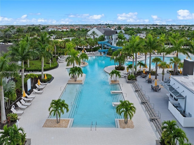 view of swimming pool featuring a patio area and a water slide