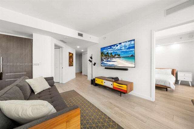 living room with light hardwood / wood-style floors