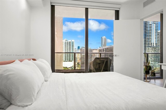 bedroom with a wall of windows