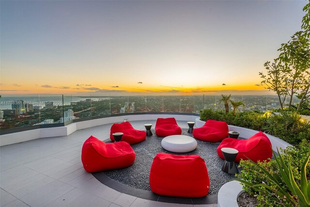 view of patio terrace at dusk