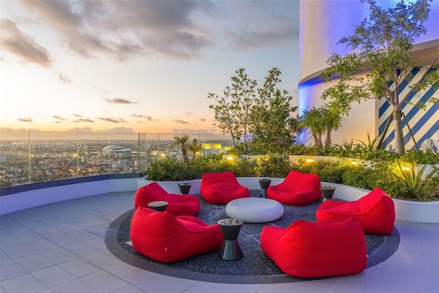 view of patio terrace at dusk