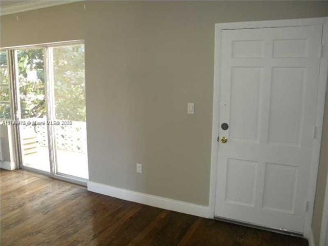 doorway to outside featuring dark hardwood / wood-style floors