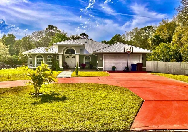 view of front of home featuring a garage and a lawn