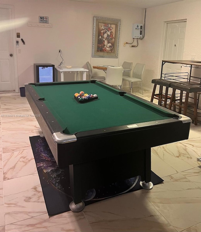 playroom with marble finish floor and pool table