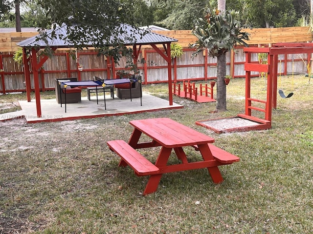 view of yard featuring a fenced backyard, a gazebo, and a patio