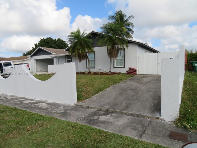 rear view of property featuring a patio and a yard