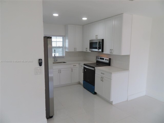 full bathroom with vanity, tiled shower / bath combo, wood-type flooring, and toilet