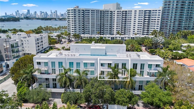 birds eye view of property featuring a water view