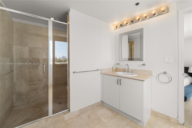 bathroom with an enclosed shower and vanity