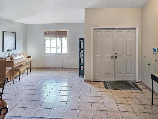 foyer entrance featuring light tile patterned floors