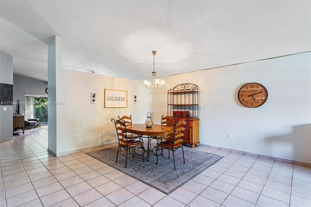 dining space featuring light tile patterned floors, vaulted ceiling, and a notable chandelier