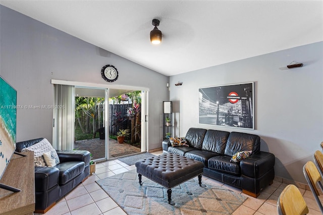 tiled living room featuring lofted ceiling