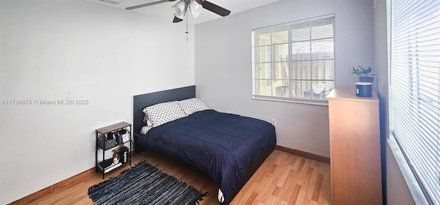 bedroom featuring light hardwood / wood-style floors and ceiling fan