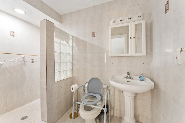 bathroom with tile walls and a tile shower