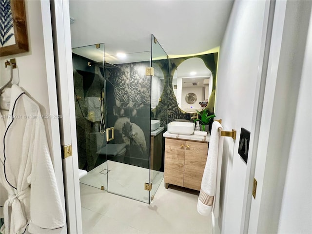 bathroom featuring vanity and a shower with shower door