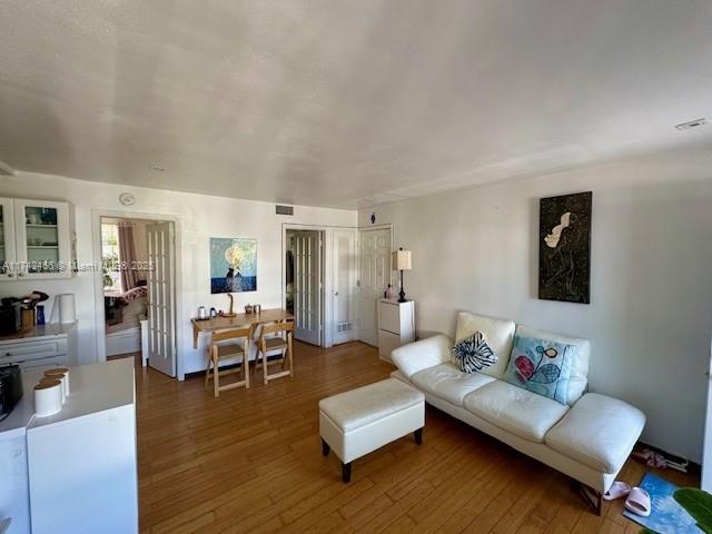 living room with dark wood-type flooring