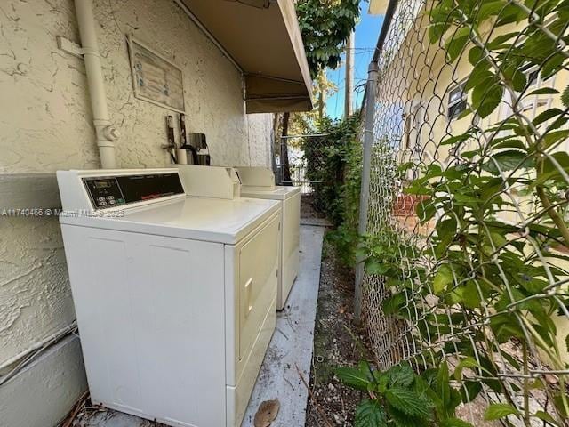 exterior space with washing machine and clothes dryer