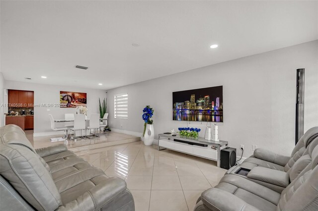 living room with light tile patterned floors