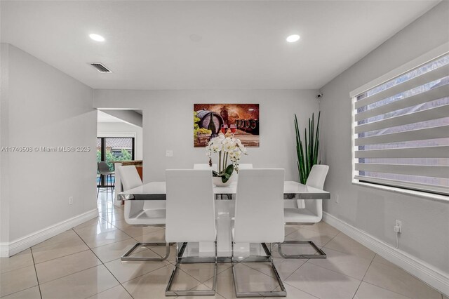 dining space with light tile patterned floors