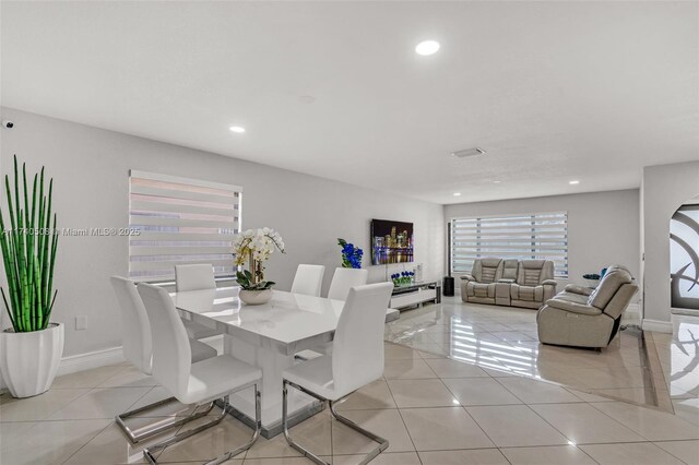 dining space with light tile patterned floors