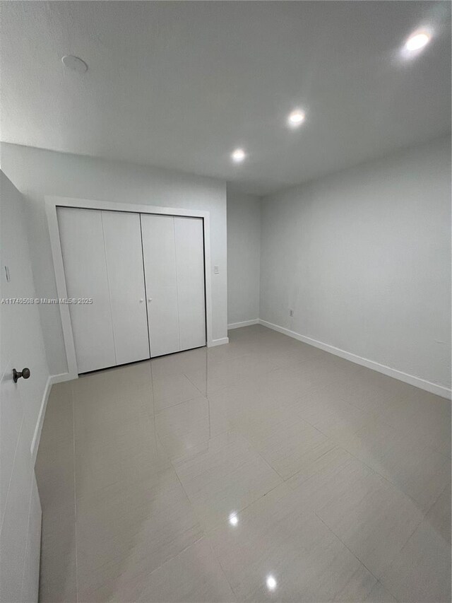 unfurnished bedroom with a closet