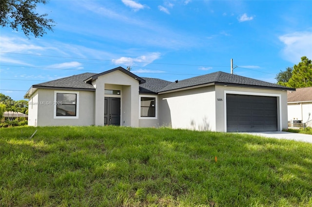 ranch-style house featuring a garage and a front yard