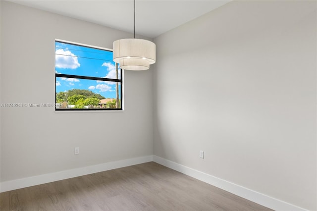 unfurnished room featuring hardwood / wood-style floors