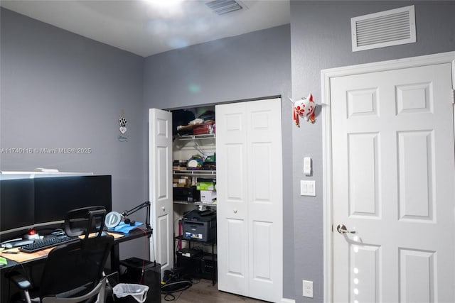 home office with hardwood / wood-style floors