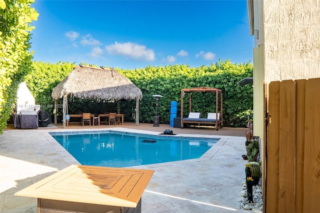 view of swimming pool featuring a gazebo and a patio area