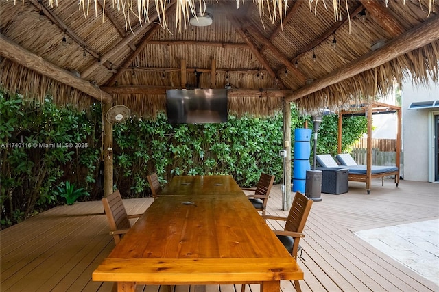 wooden terrace featuring a gazebo