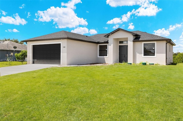 view of front facade with a garage and a front lawn