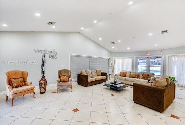 tiled living room with high vaulted ceiling