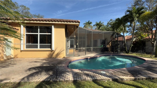 view of pool with a lanai and a patio area