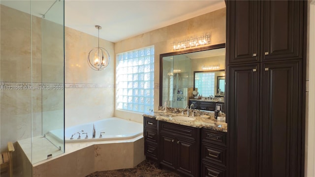 bathroom with vanity and separate shower and tub