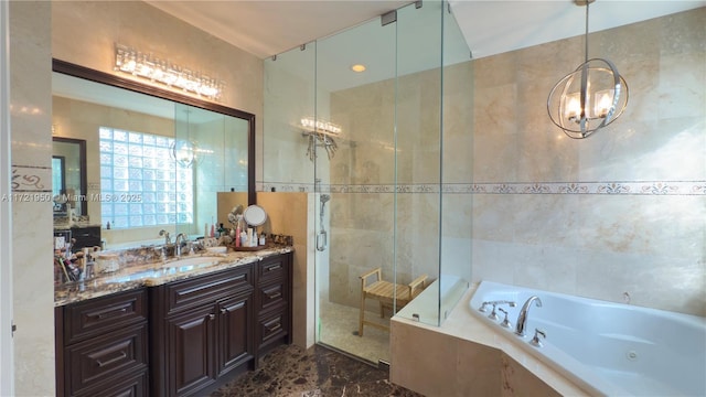 bathroom featuring vanity, tile walls, and plus walk in shower