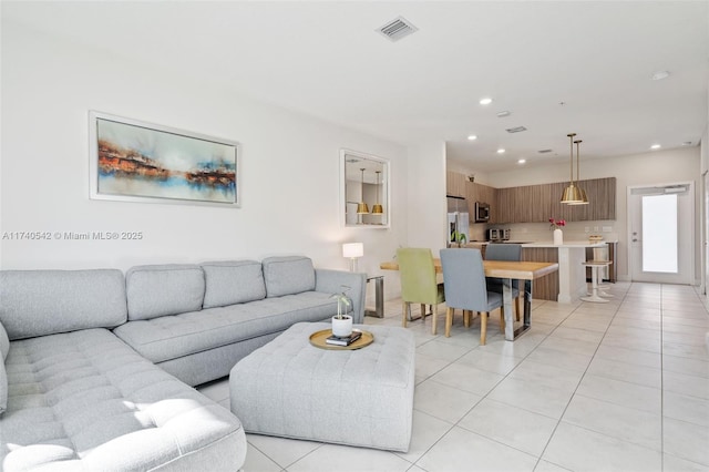 living room featuring light tile patterned flooring