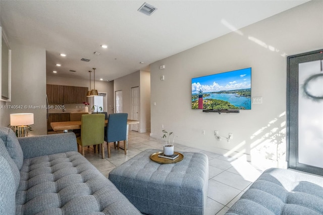 living room featuring light tile patterned flooring