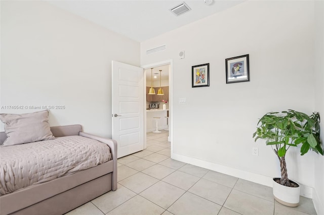 bedroom featuring light tile patterned flooring