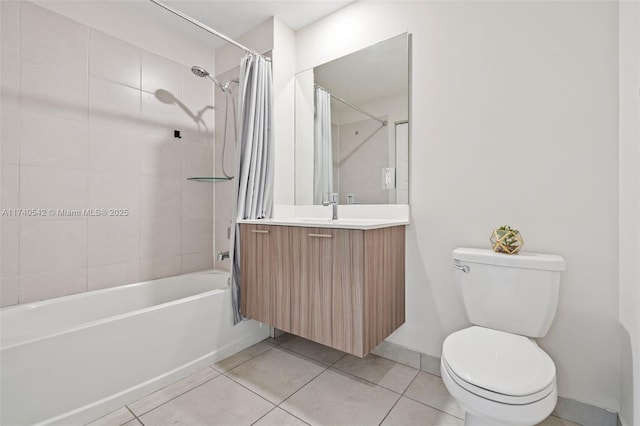 full bathroom with tile patterned flooring, vanity, shower / bath combination with curtain, and toilet