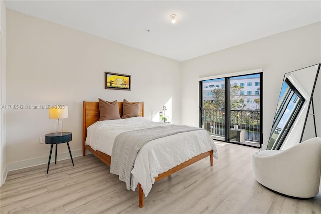 bedroom featuring access to outside and light hardwood / wood-style flooring