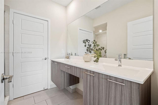 bathroom featuring tile patterned floors and vanity