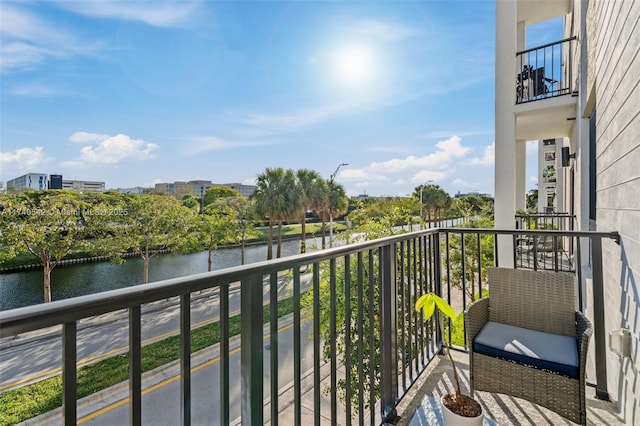 balcony featuring a water view