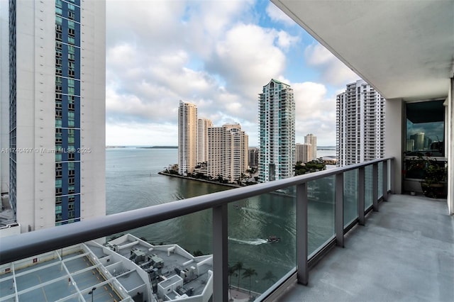 balcony featuring a water view