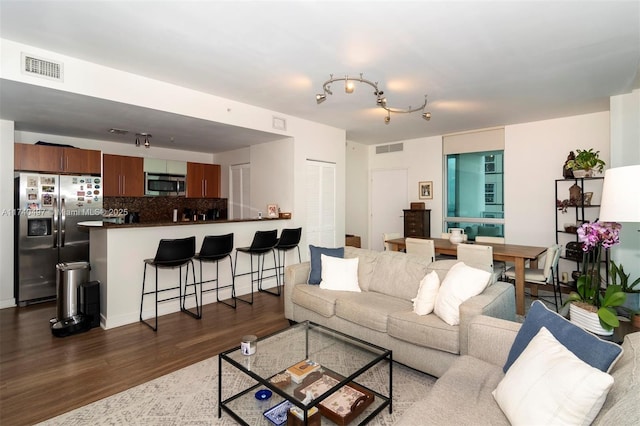 living room with dark wood-type flooring